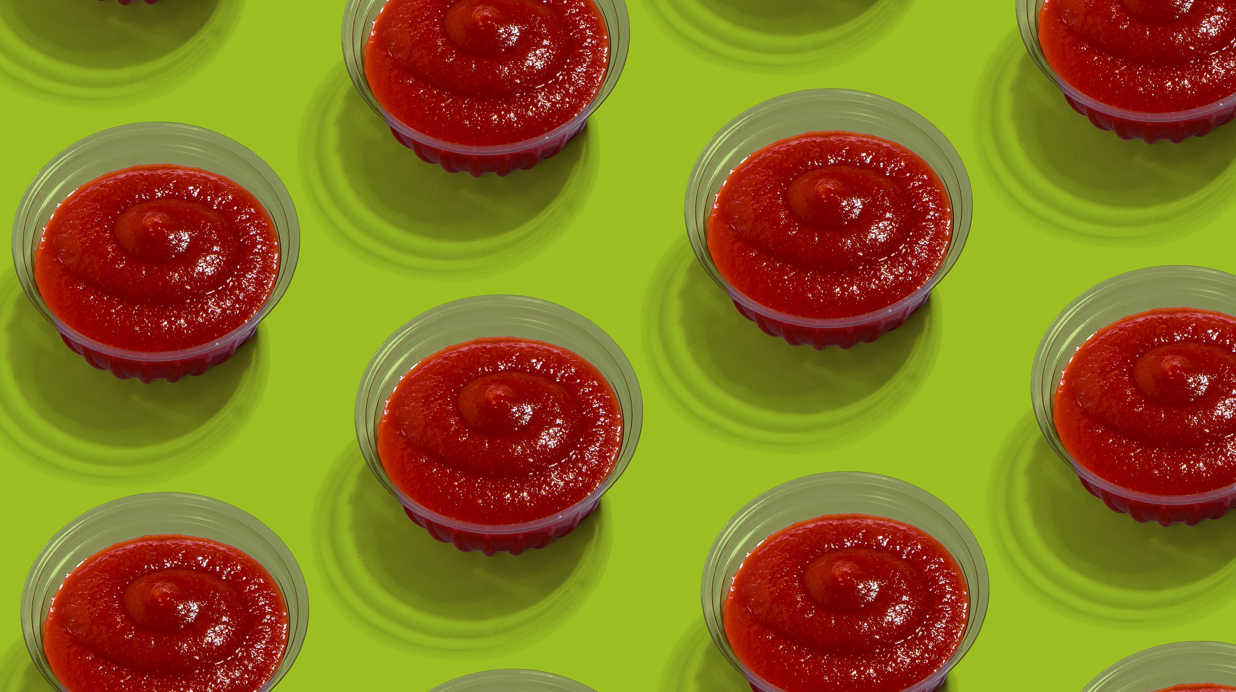 glass-bowls-with-tasty-fresh-tomato-sauce-over-gre-ZP5DJ5M-min